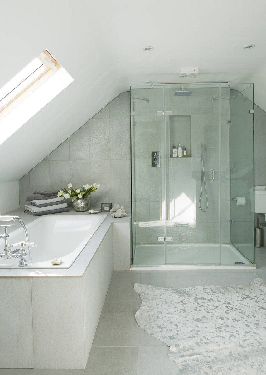 Metallic Silver on off-white cowhide rug in bathroom