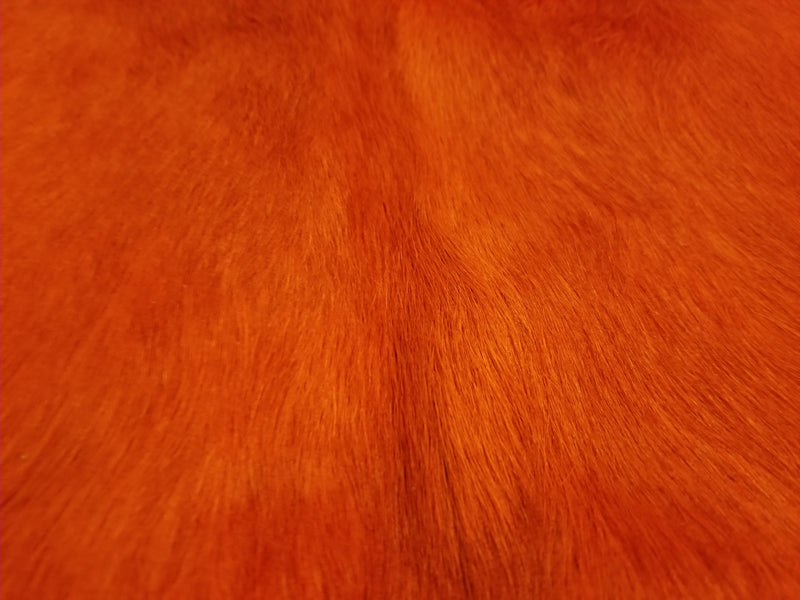 Orange dyed cowhide rug close up